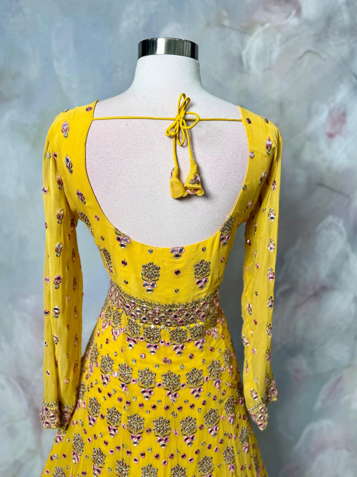 Soft hues, regal charm and magic in yellow. Available in Size 42. Step into royal vibes with this gorgeous georgette long gown & dupatta.