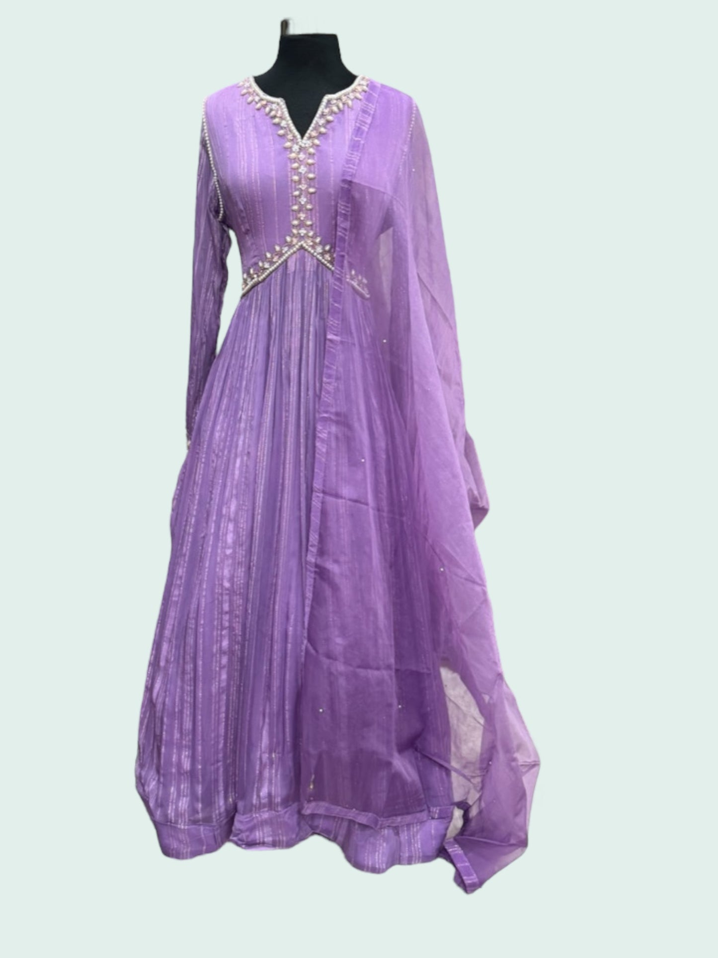 Beautiful georgette lavender gown with hand work on the yoke and hands. Available in size 42 and 44