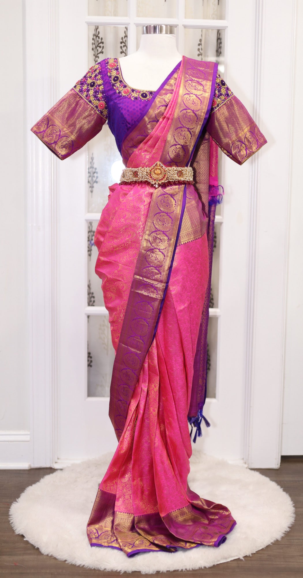 Elegance personified! 💖💜 Pure Kanjeevaram silk saree in Rani pink and Purple combo, certified with Silk Mark. Adorned with exquisite Maggam work blouse featuring Zardosi and knot work. Size 40 plus 3 in margin.