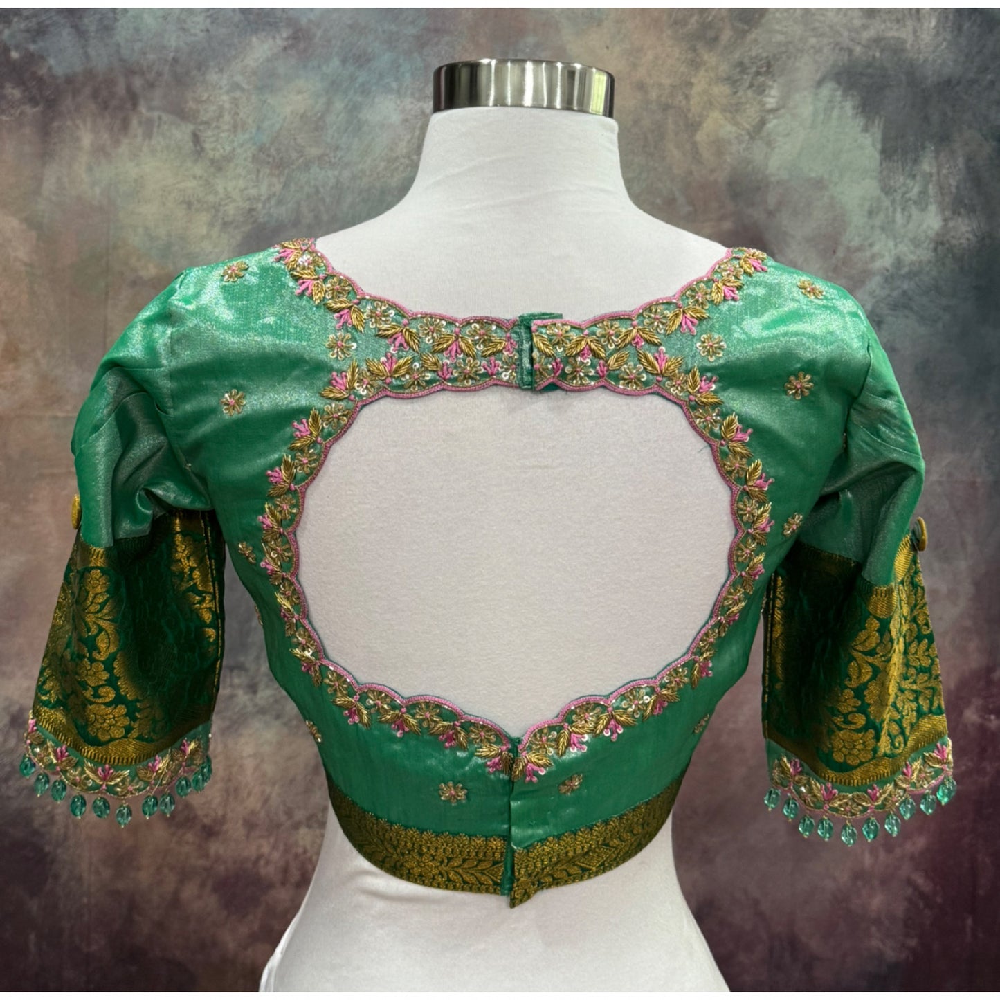 Kanchi Pattu half saree in shades of pinkgreen. Paired with a rich Maggam work designer blouse size is 36 to 40 its perfect for festive vie