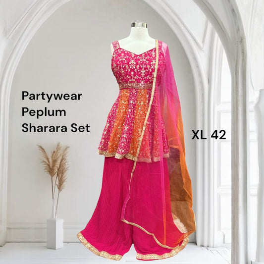 Stunning Partywear Peplum Sharara Set in vibrant shades of pink and orange comes with exquisite embroidery work. Perfect for weddings, sangeet, or festival. Size is XL 42