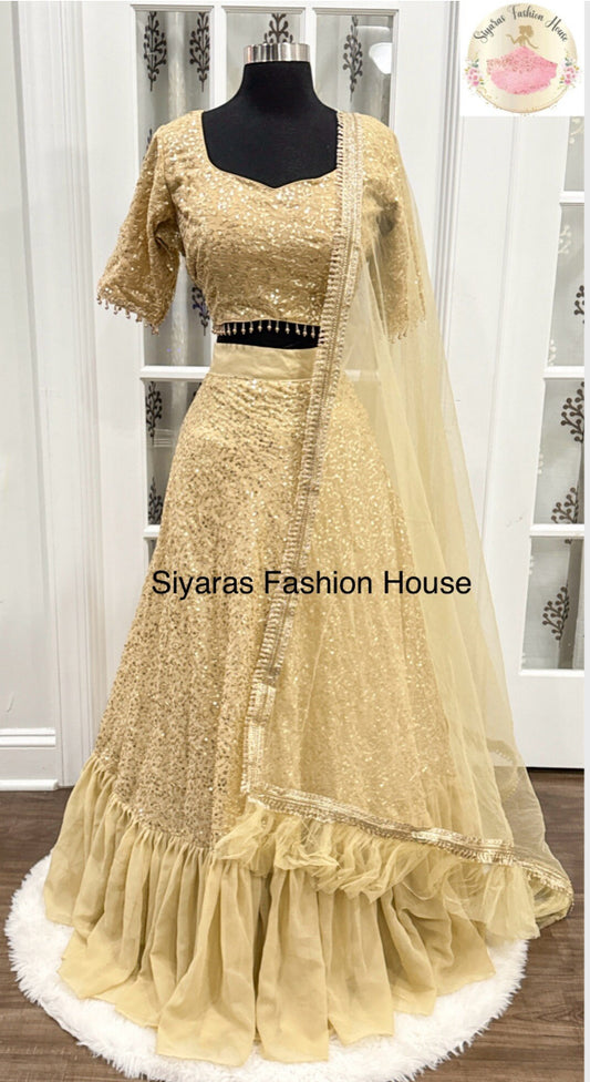 Beautiful gold Sequin Ruffle Style Resham Sequence Embroidered Lehenga
Champagne gold color scheme
Design: Ruffle Style with Resham Sequence Embroidery
Fabric: Georgette
Stitching: Fully Stitched
Size: 42
Lehenga Length: 42 inches
Occasion: