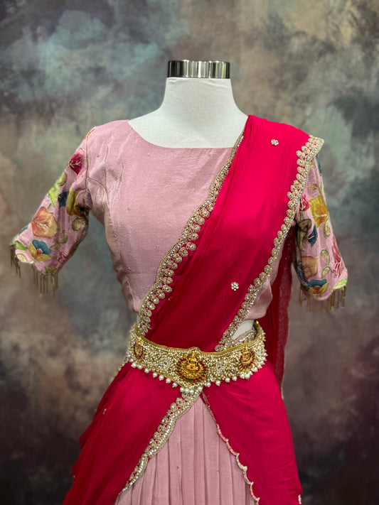 Beautiful Tissue half saree with Kalamkari design and sequence and Zari work on it. Available in size 34 to 42