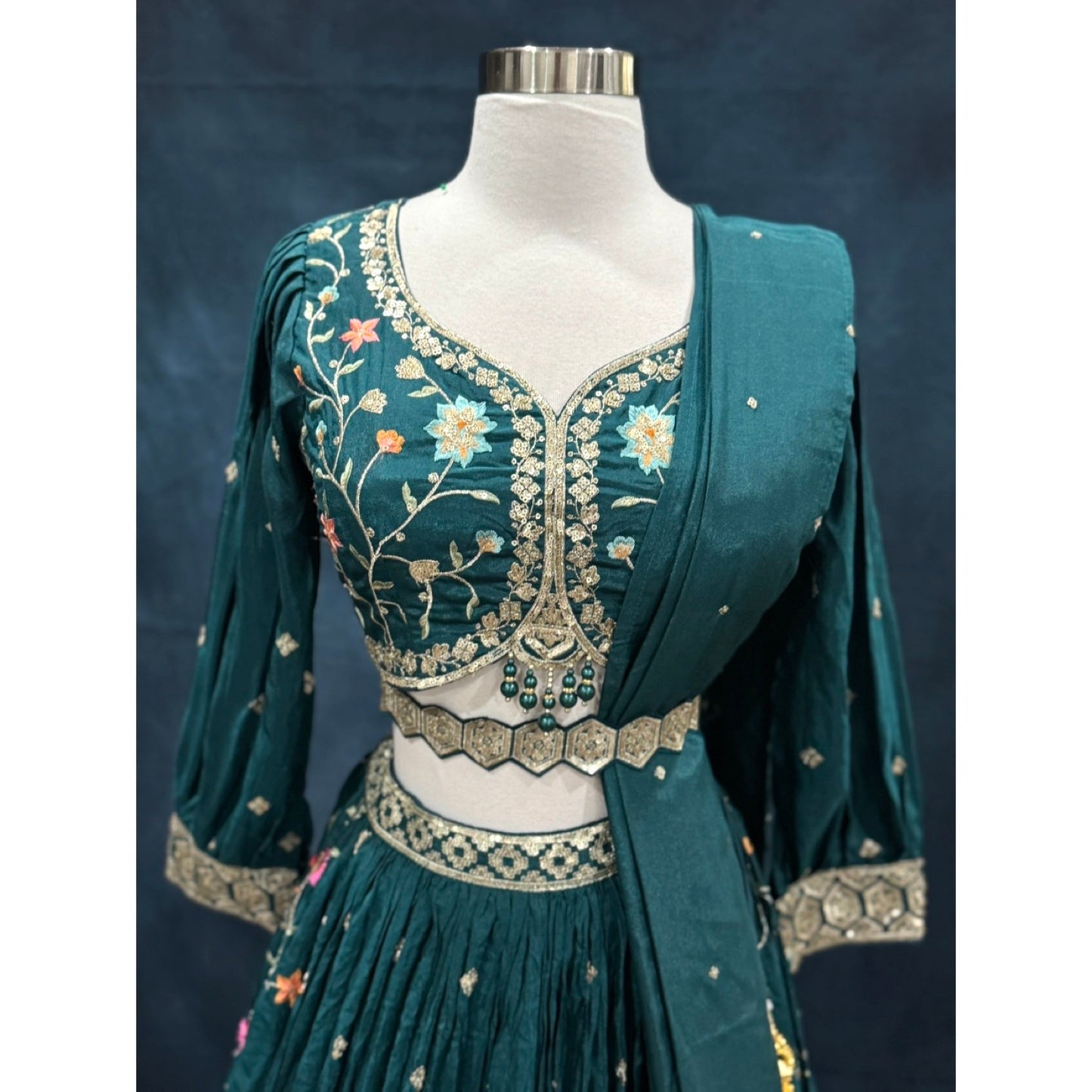 Beautiful party wear lehenga with colorful embroidery and sequins. Available in size 40.