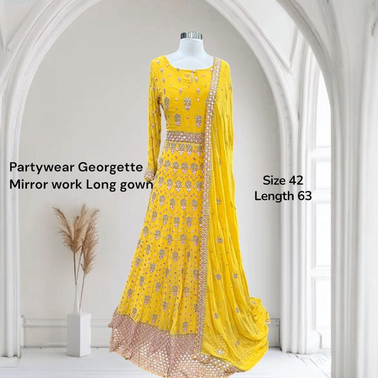 Soft hues, regal charm and magic in yellow. Available in Size 42. Step into royal vibes with this gorgeous georgette long gown & dupatta.
