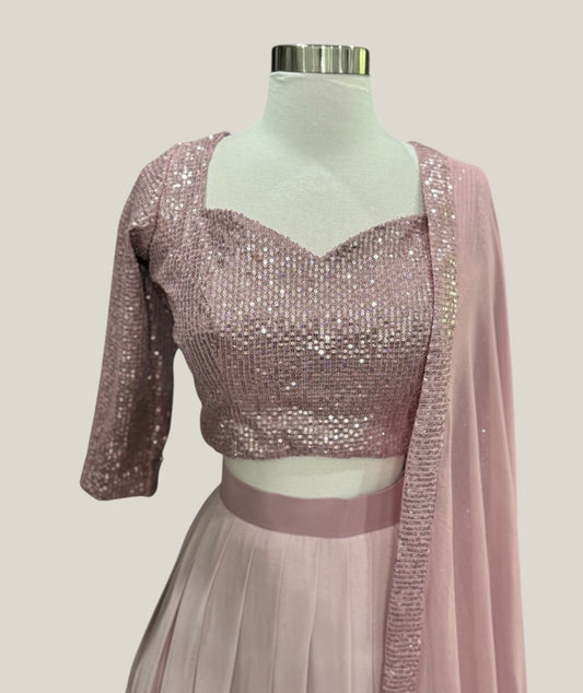 Customized Rose Gold Georgette sequin Lehanga from Siyaras Fashion House. Available in size 40/42 to 46