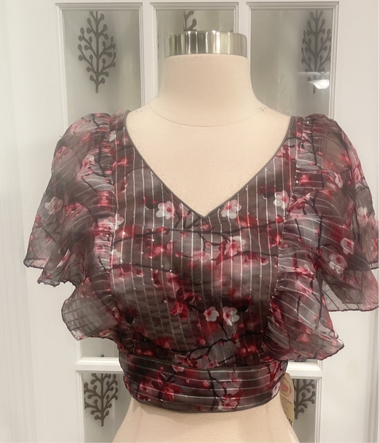 Beautiful floral raffle hands blouse with sequins on it. Available in size 36 / 38