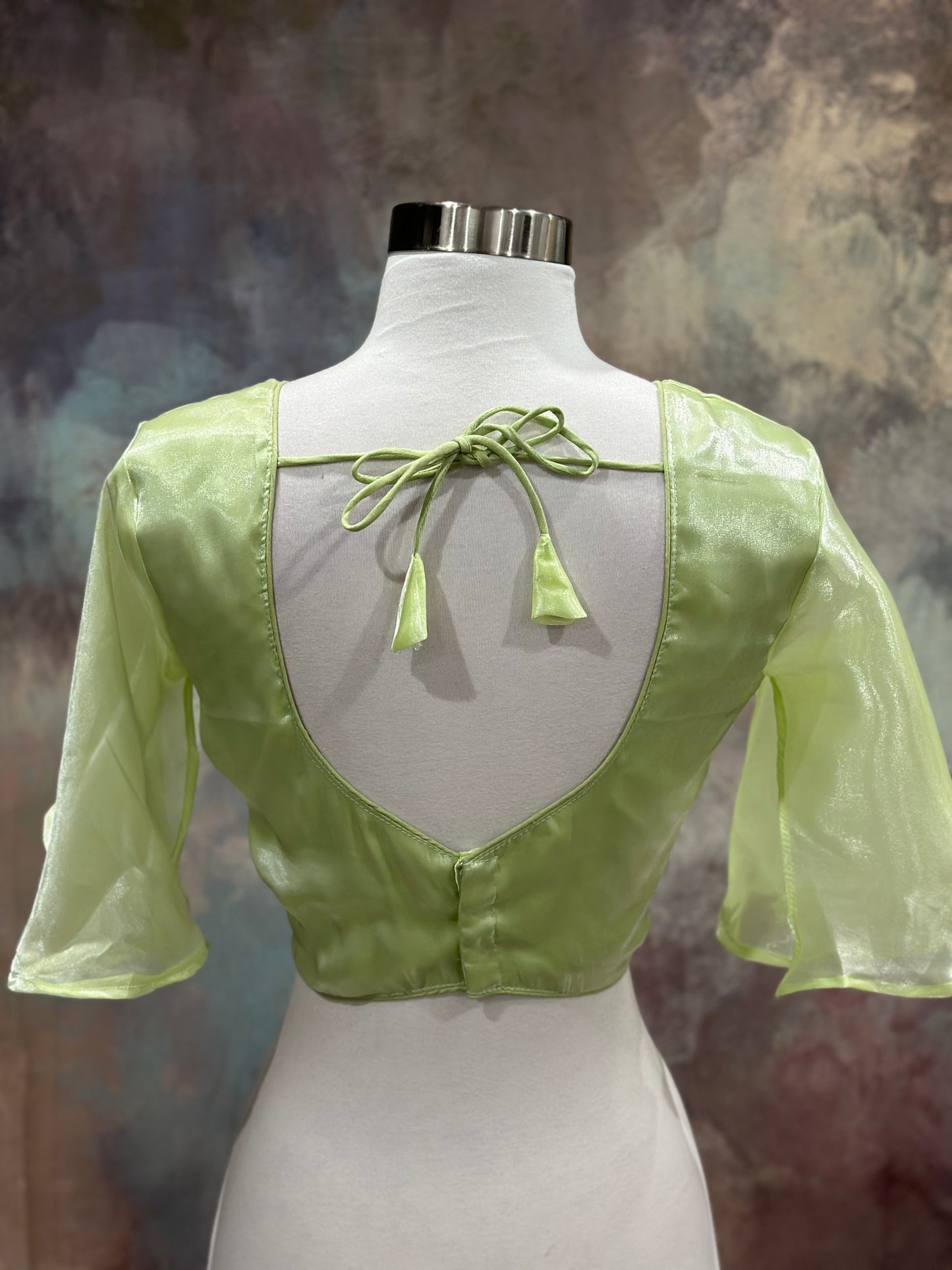 Dazzling organza saree in tow shades green with a designer umbrella blouse inner cut . Perfect for weddings and festive celebrations