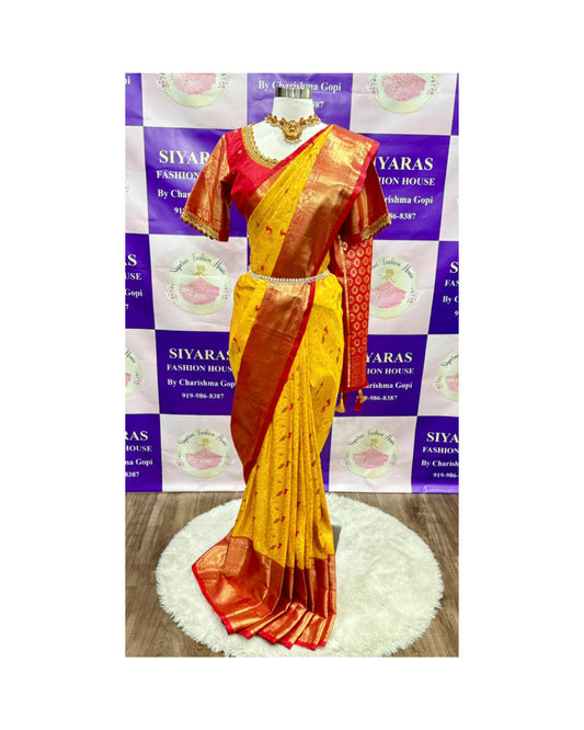 This stunning Kanchi Pattu Saree in vibrant yellow with a rich red border is paired with a Maggam work blouse that steals the spotlight with its intricate craftsmanship. Available in size 40 upto 42.