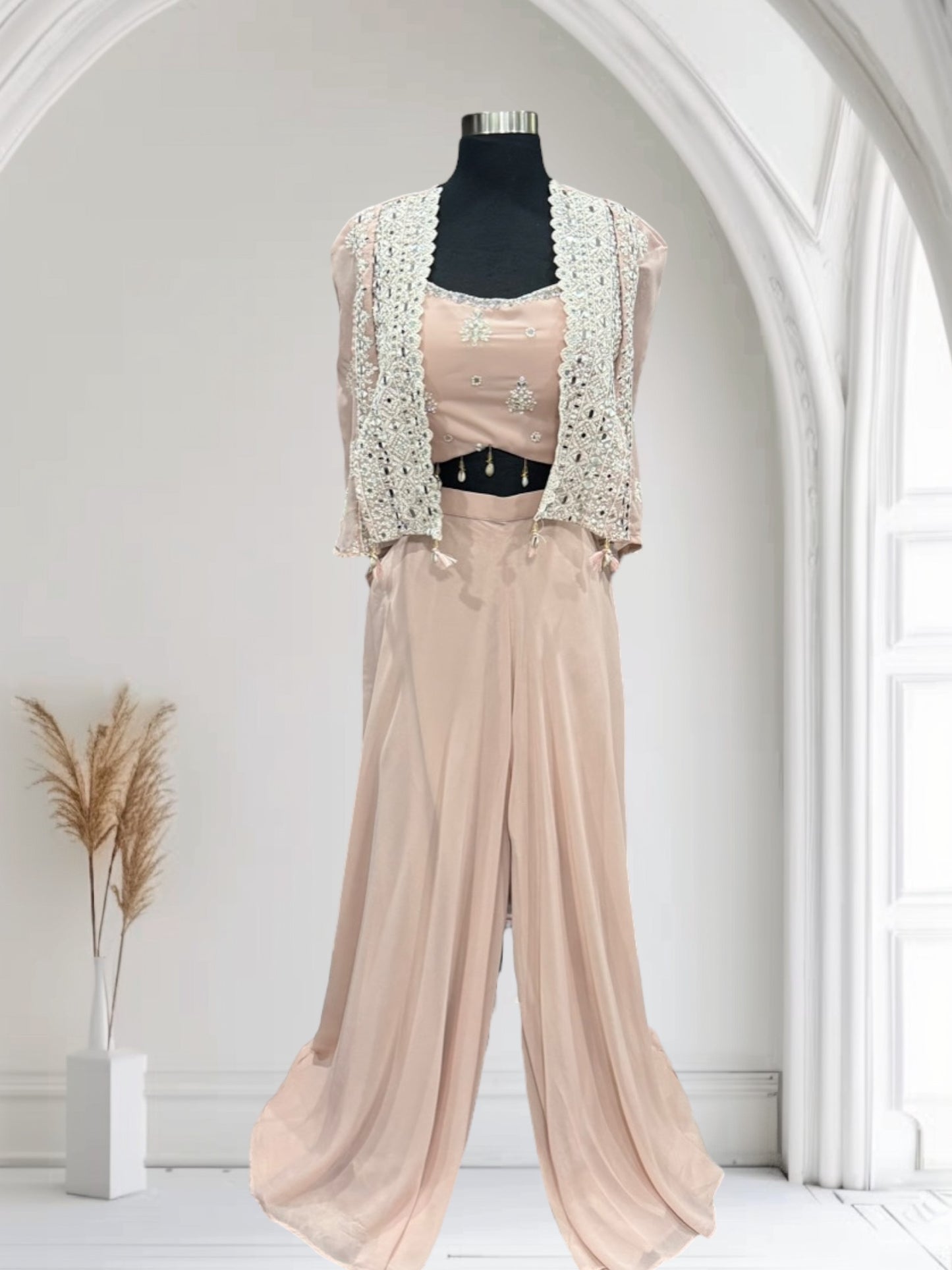 Beautiful pastel Pallazo crop top with a lovely Cape to style. Available in size 40.