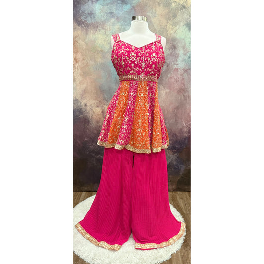 Stunning Partywear Peplum Sharara Set in vibrant shades of pink and orange comes with exquisite embroidery work. Perfect for weddings, sangeet, or festival. Size is XL 42