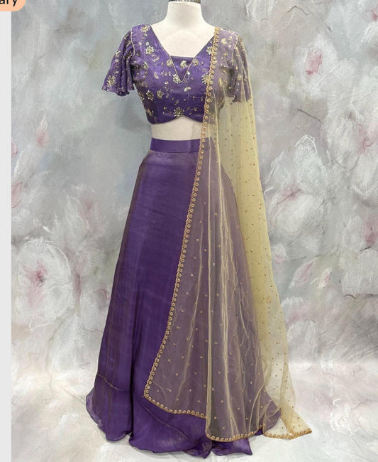 Custom elegance by Siyaras Fashion House. Size 36-38. This customized tissue crop top lehenga set from Siyaras Fashion House features a rich