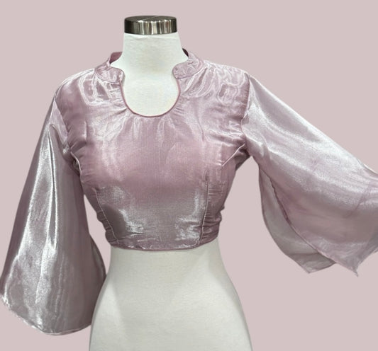 Dazzling organza saree in lavender shade with a designer umbrella blouse inner cut . Perfect for weddings and festive celebrations