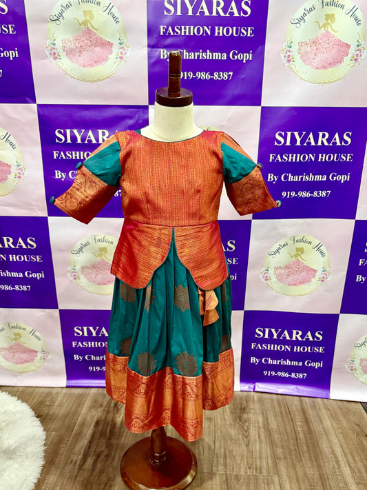 Beautiful traditional Pattu Pavada for kids girls. Available in size 28 and can be extended up to 30. Skirt length is 29 can be extended upto 35