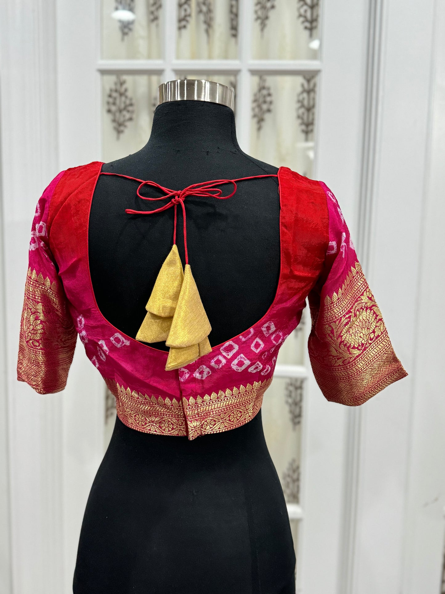 Beautiful Kanjivaram art silk with Bandini Pink and red combo saree with Pattu border. Blouse fits size 40 to 44.