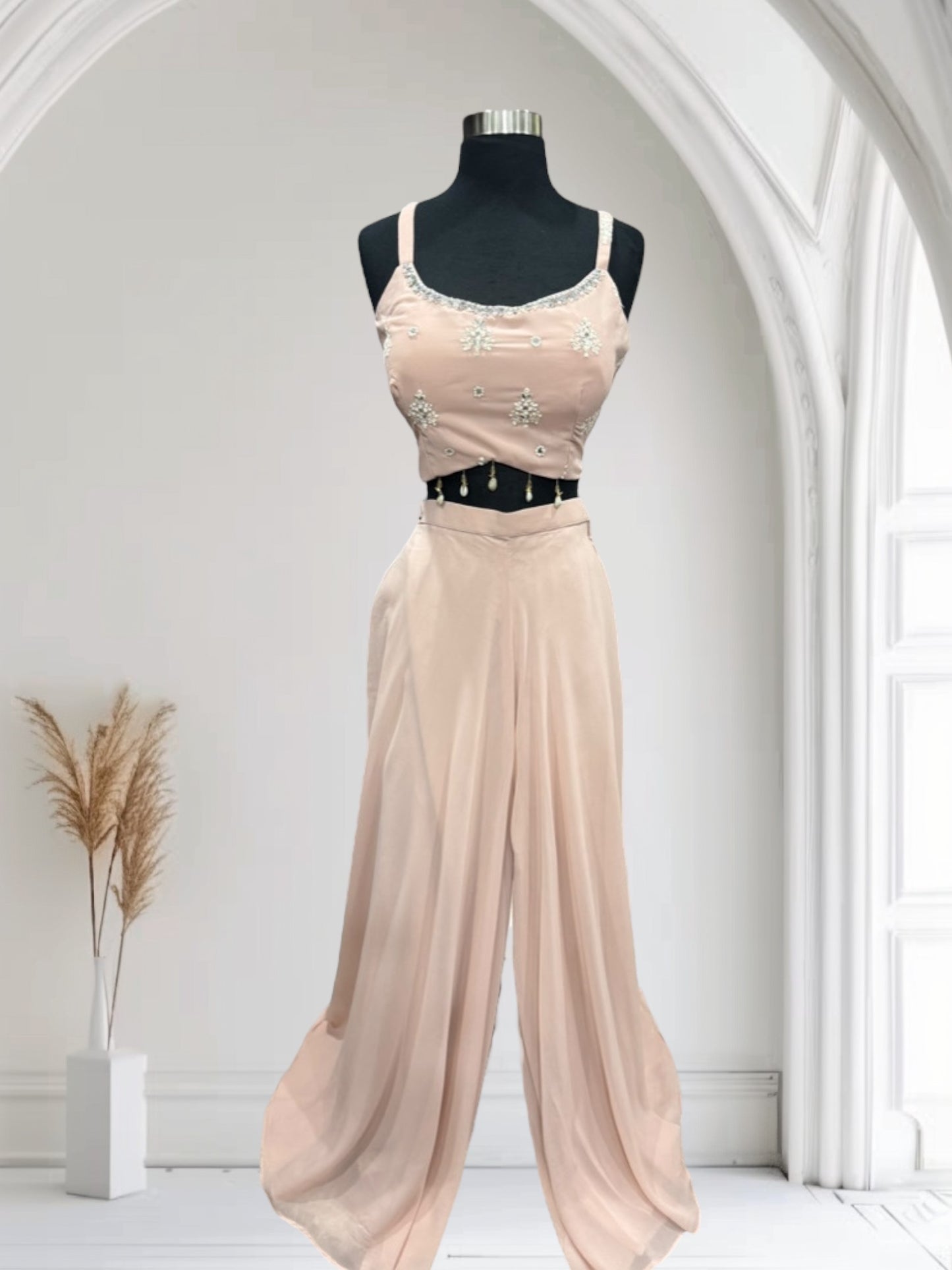 Beautiful pastel Pallazo crop top with a lovely Cape to style. Available in size 40.
