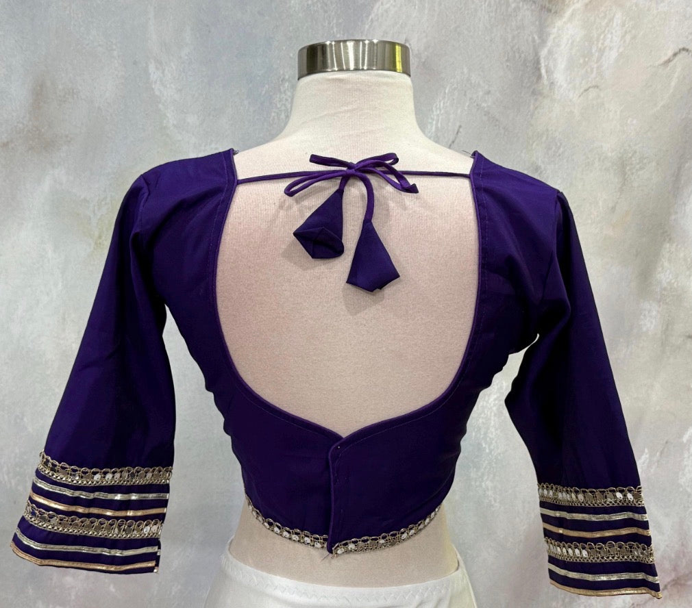Beautiful purple ensemble with stunning border details. Gorgeous embellished dupatta with the blouse. Available in size 38 to 40