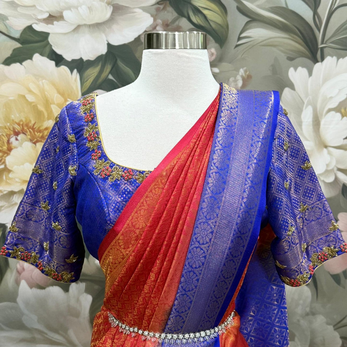 This stunning Soft Silk Saree paired with a royal Maggam work blouse. The rich hues of red and blue blend beautifully, making it perfect for weddings, festive vibes. Available in size 40 - 42.
