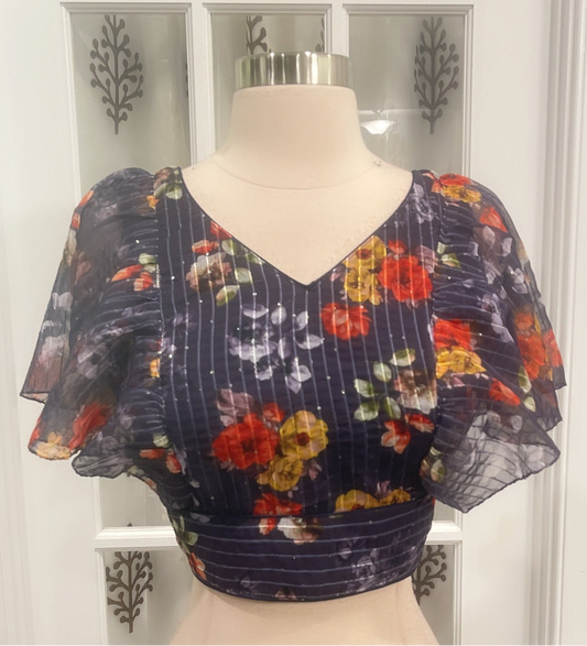 Beautiful floral raffle hands blouse with sequins on it. Available in size 36 / 38