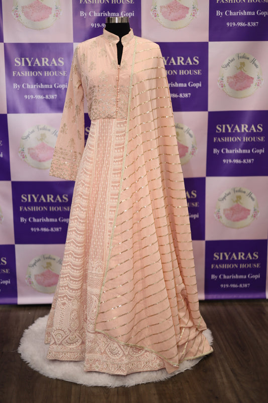 On Sale Gorgeous peach color Partywear Long Gown with shirt style collar neck and full sleeves in georgette fabric for a classic partywear