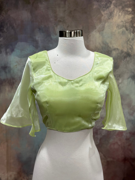 Dazzling organza saree in tow shades green with a designer umbrella blouse inner cut . Perfect for weddings and festive celebrations