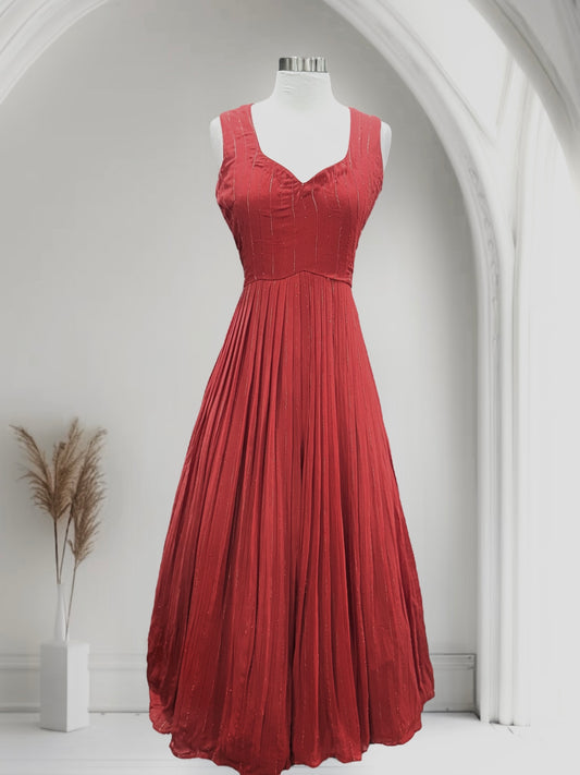 Beautiful brick red color customized gown in gorgette fabric. Available in size 40/42 fits upto 46. Can be altered