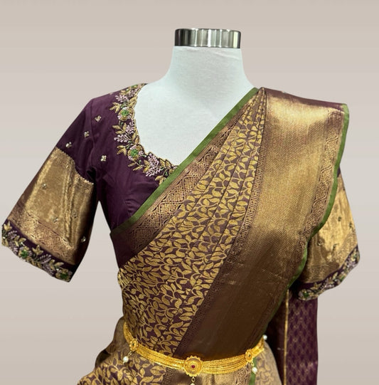 Adorn tradition with elegance in this purple and gold Gadwal Silk saree, paired with a stunning Maggam work blouse.
Size 40-44.