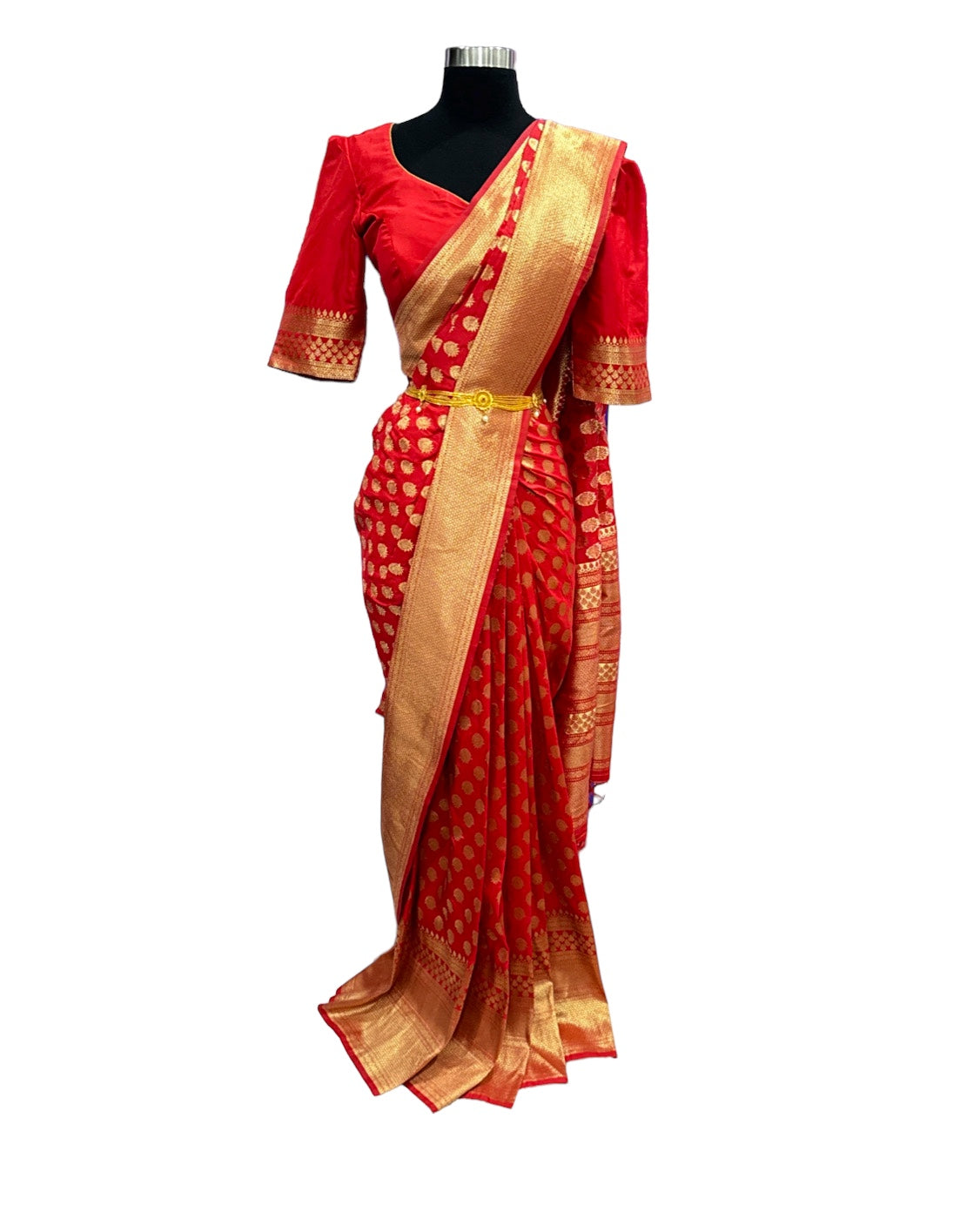 Fiery Red silk saree with elaborate zari work and comes with stitched Designer Blouse