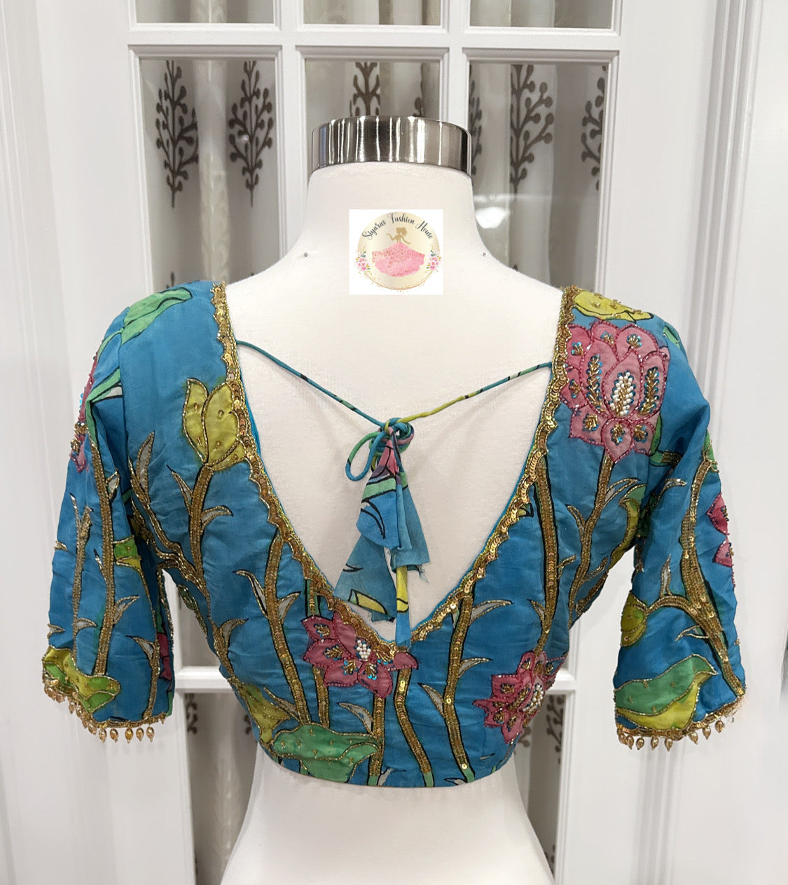 Teal blue Pure Pen Kalamkari Blouse with Maggam work hand painted with vegetable colors and elegant work bead hangings