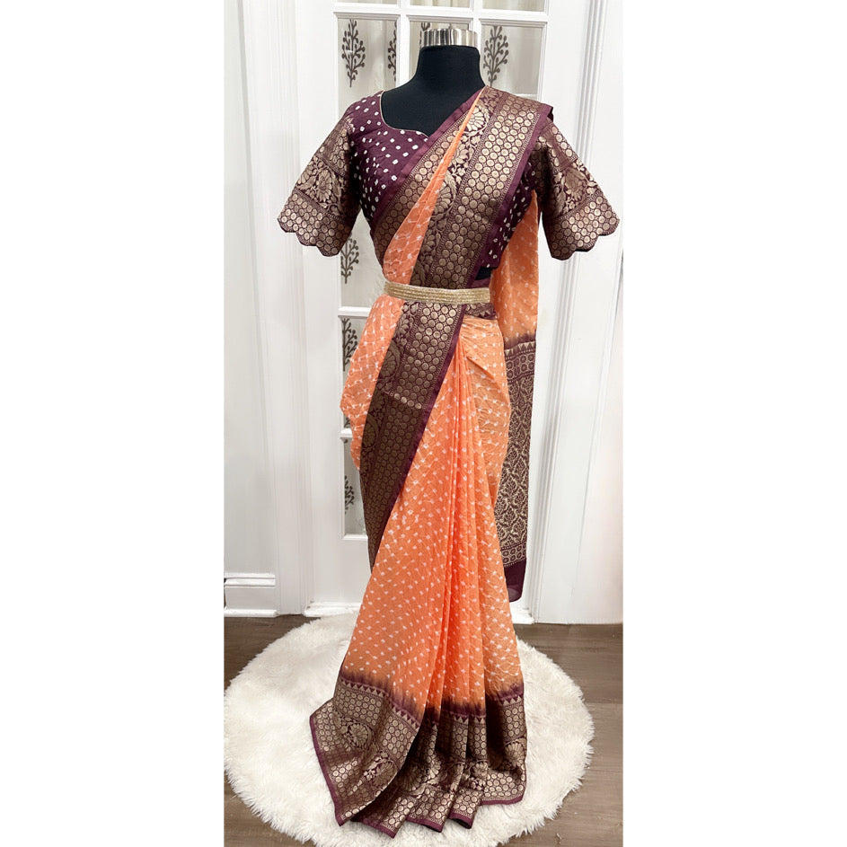 Gorgeous Pure Bandhini Silk Saree with grand zari border that is handwoven with intricate design. The pallu is grand with all over zari work