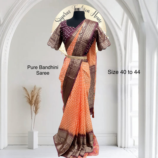 Gorgeous Pure Bandhini Silk Saree with grand zari border that is handwoven with intricate design. The pallu is grand with all over zari work