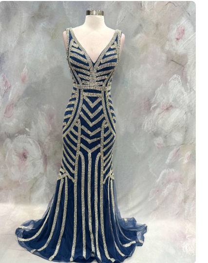 Elegant blue evening gown featuring stunning silver beaded stripe work throughout the dress. Size 32 waist 28