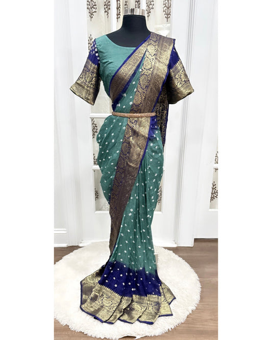 Beautiful Kanjivaram art silk with Bandini Green and Navy blue combo saree with Pattu border. Blouse fits size 40 to 44.