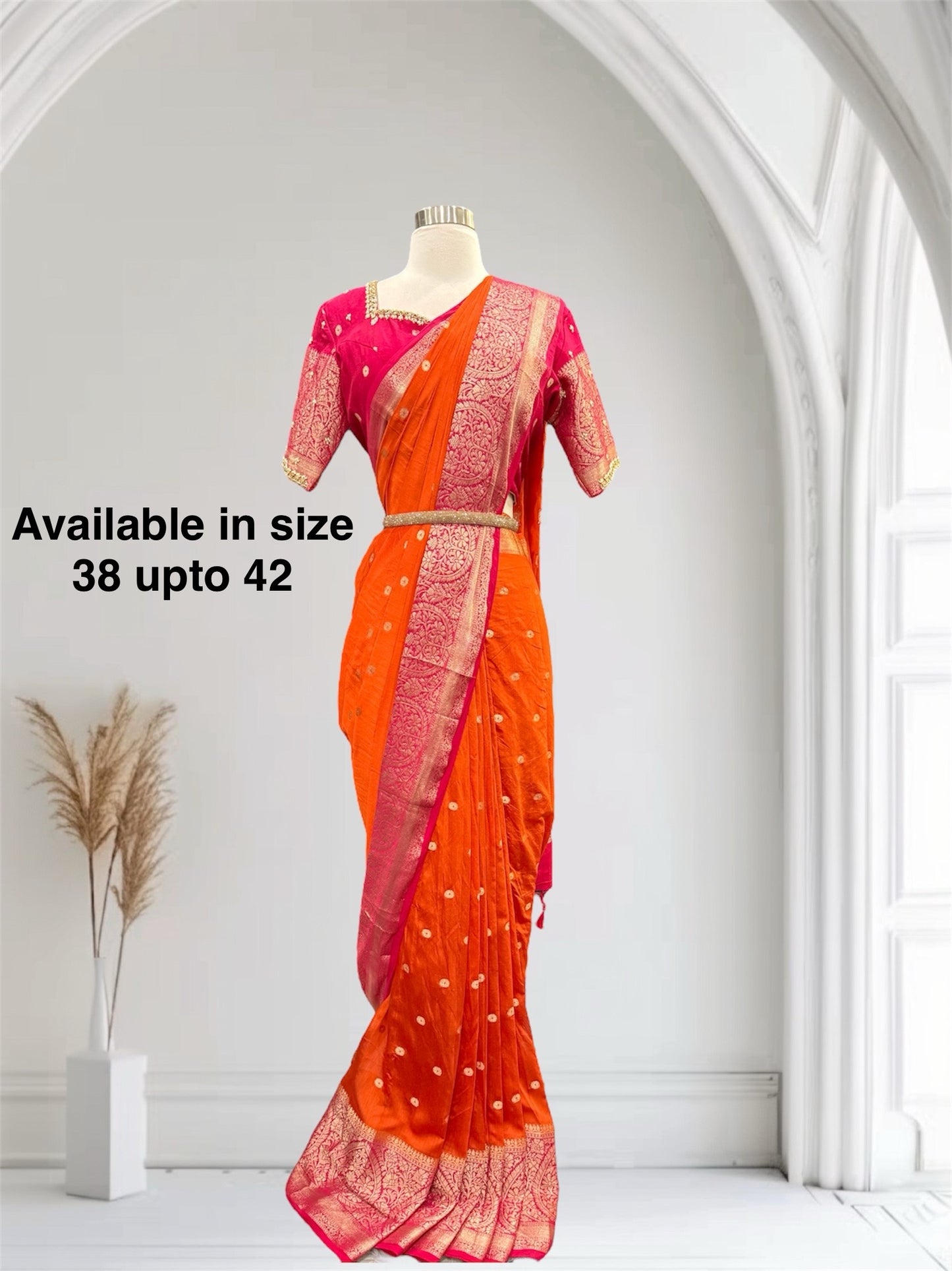 Stunning orange and pink combo Raw Mango silk saree paired with a contrasting pink blouse and Hand work on the blouse. Available in size 38 upto 42. Can be altered to your size.