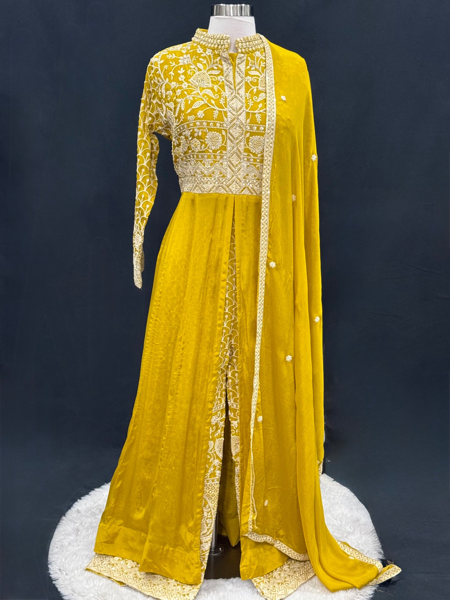 Step into elegance with this stunning mustard yellow Anarkali suit, featuring intricate thread and zari embroidery. Available in size 42.