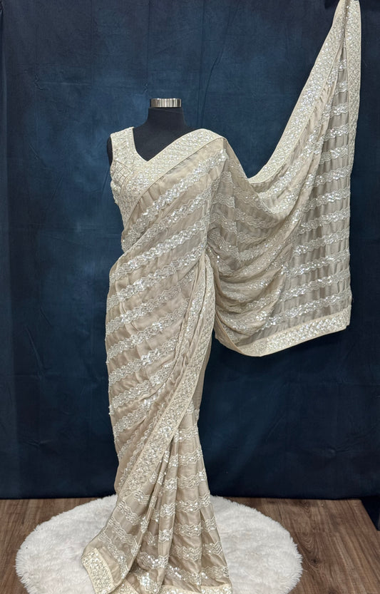 Beautiful party wear sequin saree in Almond color/ soft beige. Available in size 40 to 44