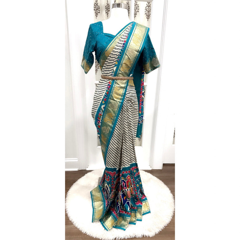 Lehariya Patola silk saree in Spanish blue color with stitched Blouse size fits 38 to 42. Can be altered to your size