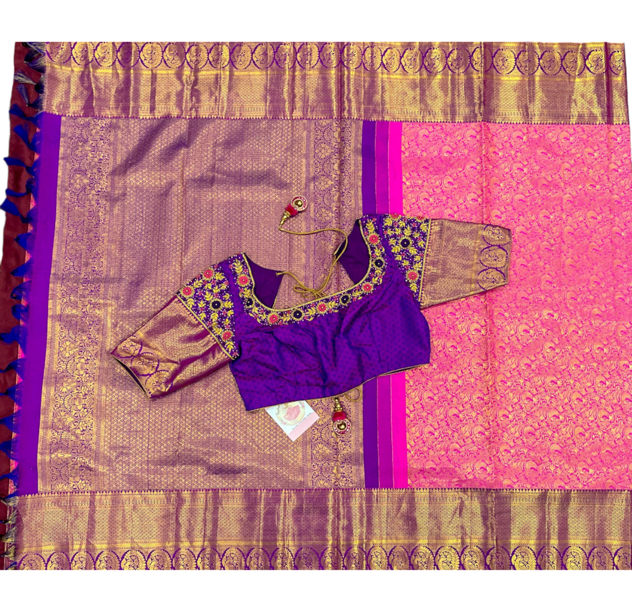 Elegance personified! 💖💜 Pure Kanjeevaram silk saree in Rani pink and Purple combo, certified with Silk Mark. Adorned with exquisite Maggam work blouse featuring Zardosi and knot work. Size 40 plus 3 in margin.