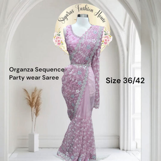 This lilac organza sequence saree is all things glam, grace & glow 🌸💃 Perfect for your next celebration! 💫👑  Fits ize 36-42 and Sleeves can be attached. 
#OrganzaSaree #PartyWearSaree #SareeLove #EthnicElegance #DesiGlam