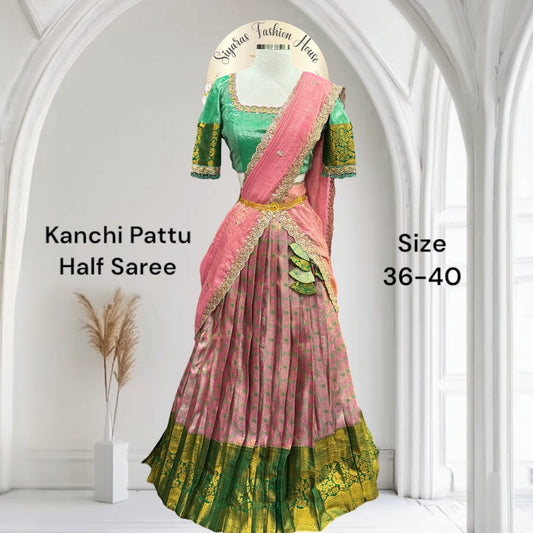Kanchi Pattu half saree in shades of pinkgreen. Paired with a rich Maggam work designer blouse size is 36 to 40 its perfect for festive vie