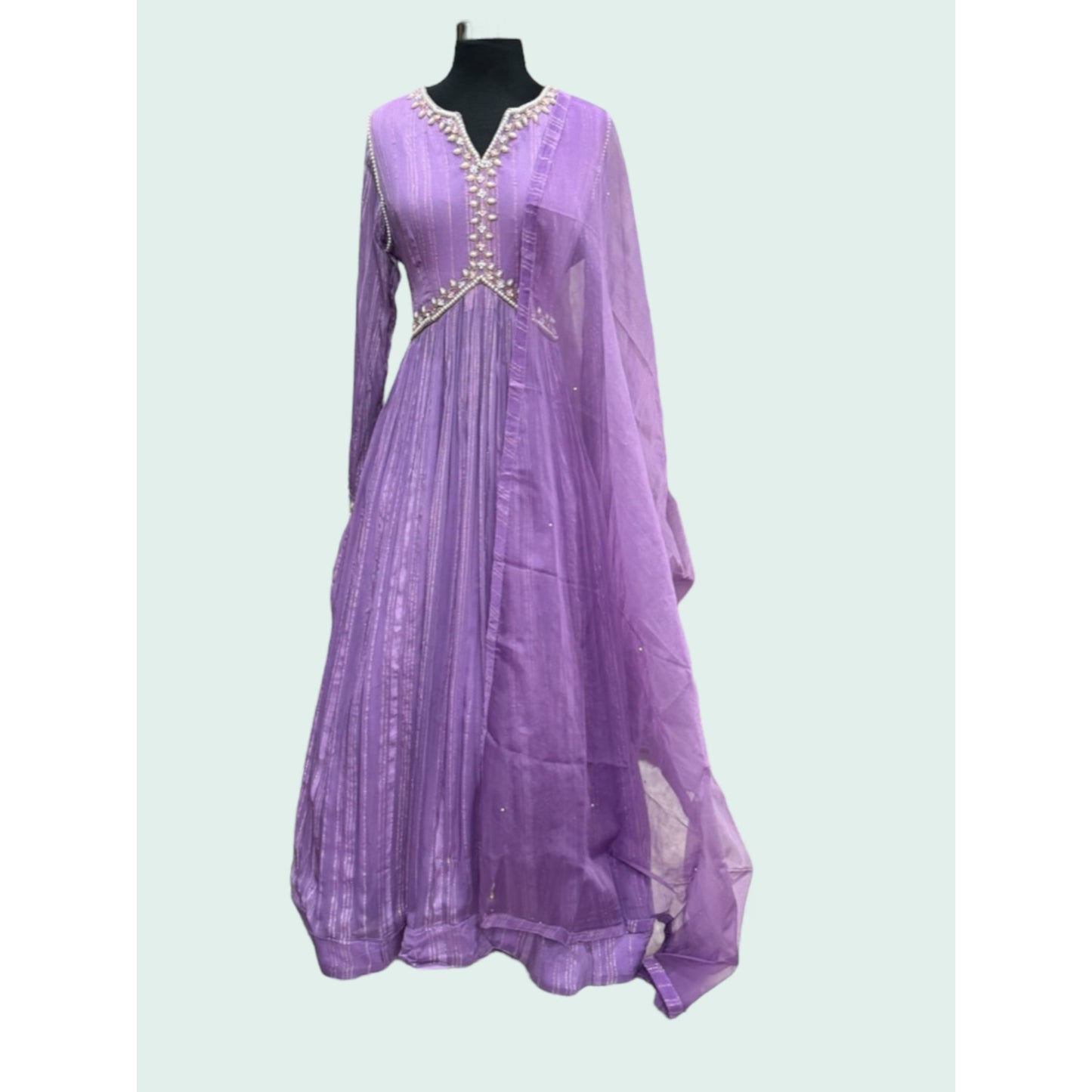 Beautiful georgette lavender gown with hand work on the yoke and hands. Available in size 42 and 44