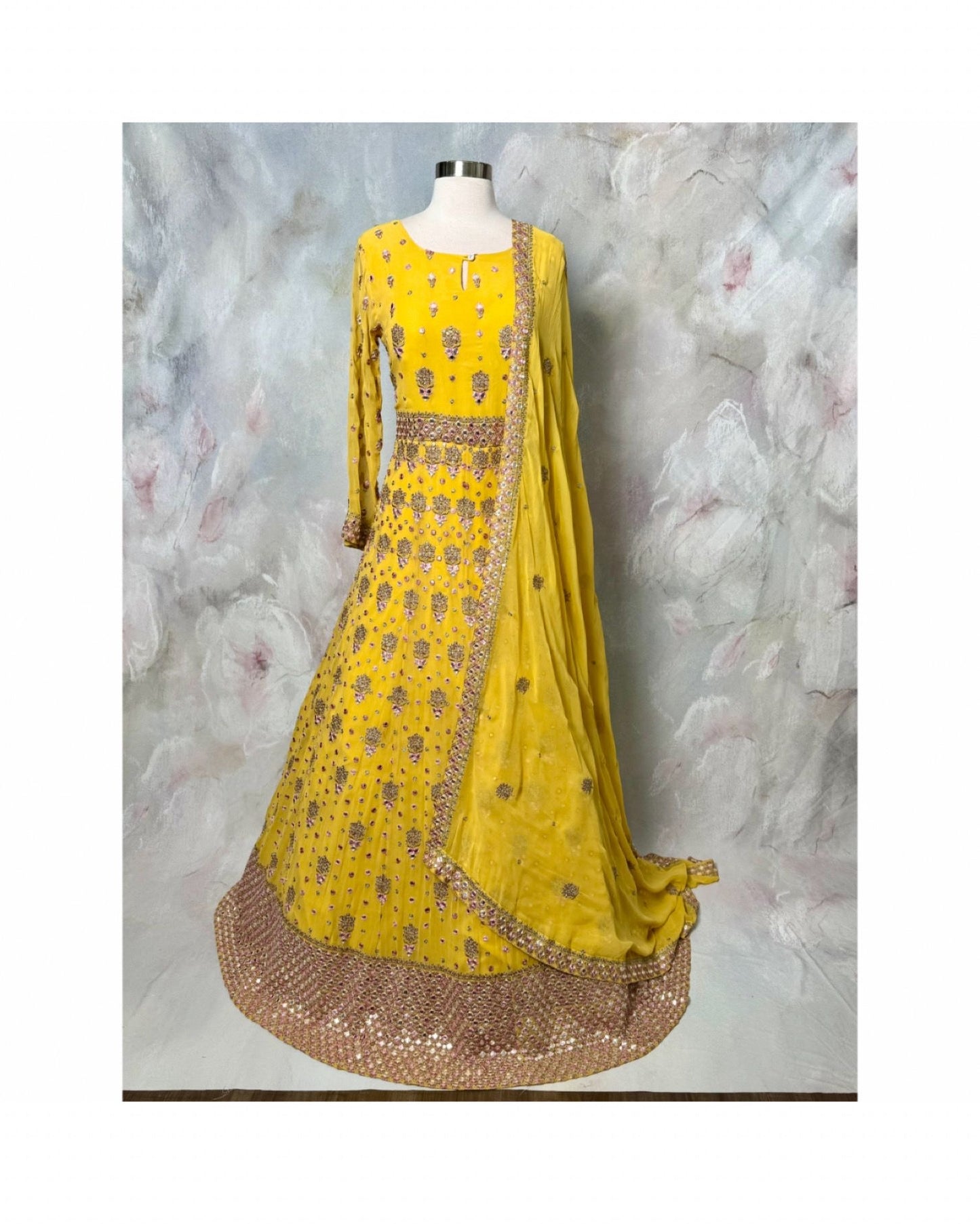 Soft hues, regal charm and magic in yellow. Available in Size 42. Step into royal vibes with this gorgeous georgette long gown & dupatta.
