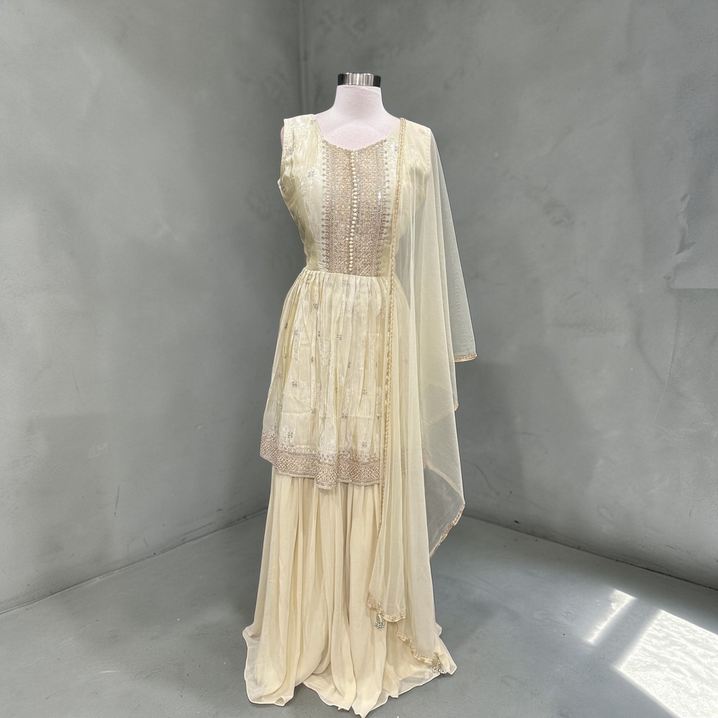 Elegant Off-white gold rich silk sharara set with delicate sequin detailing for that royal glow size 40