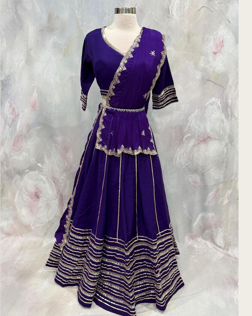 Beautiful purple ensemble with stunning border details. Gorgeous embellished dupatta with the blouse. Available in size 38 to 40