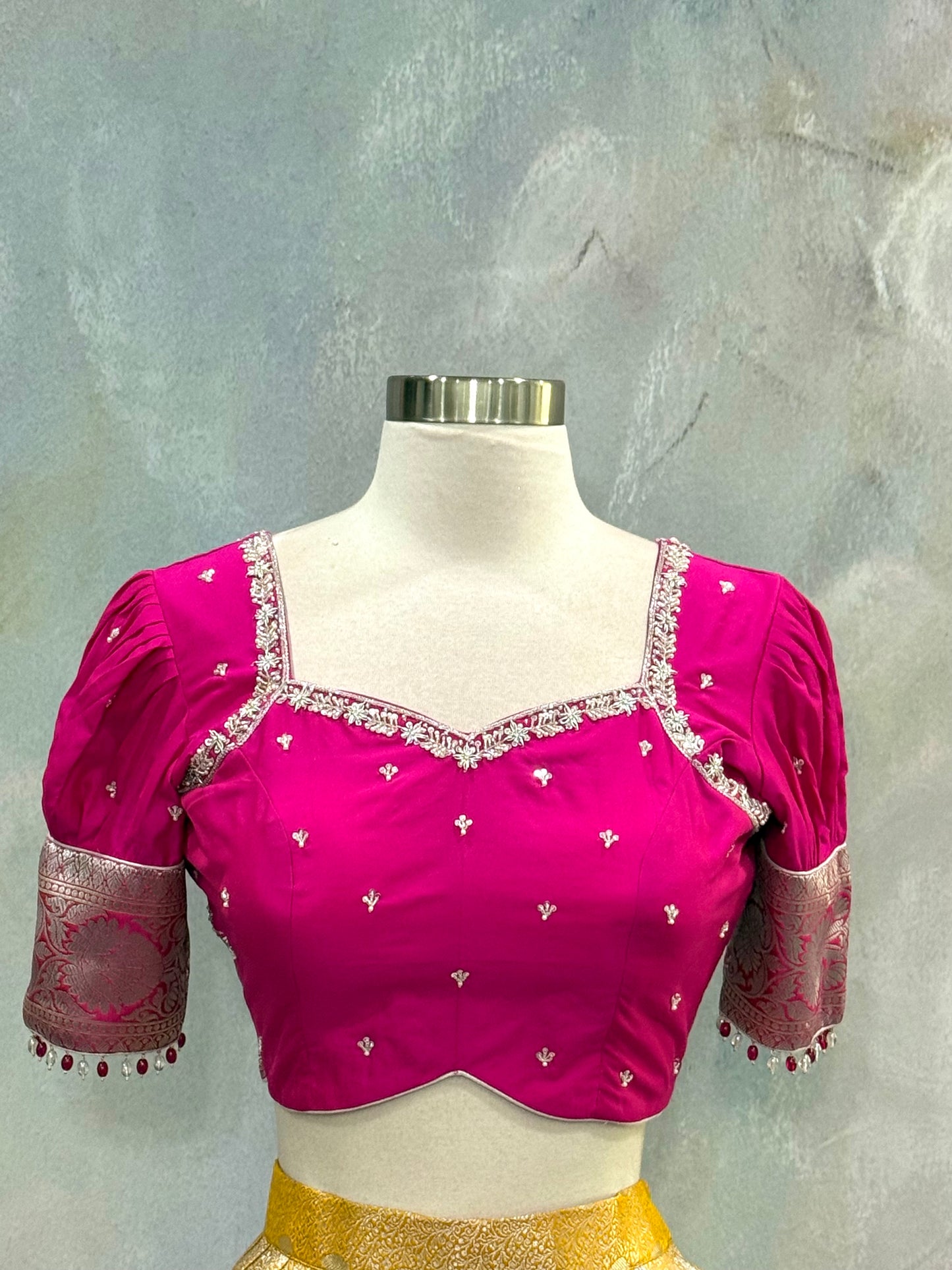 Beautiful Customized Banarasi silk half sarees in yellow and magenta pink hues Maggam work blouses and bead embellishments size 34 to 38