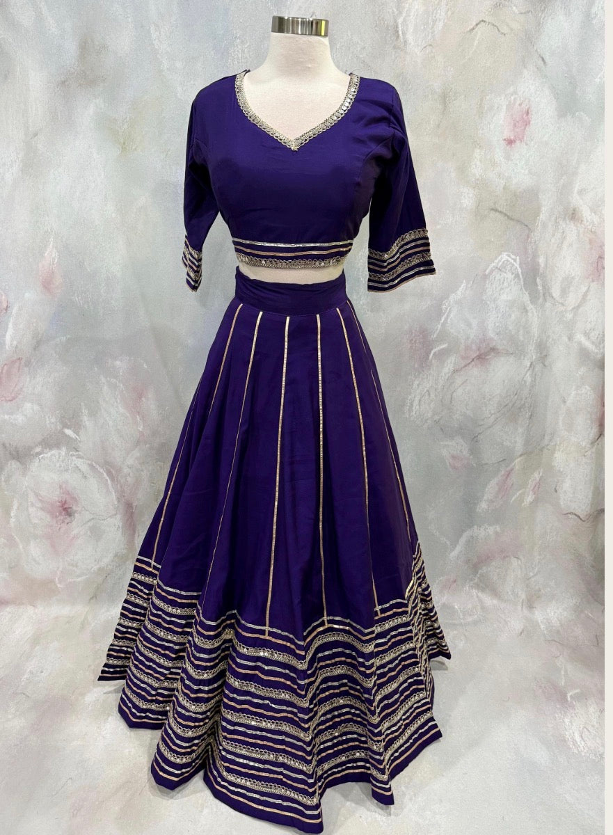 Beautiful purple ensemble with stunning border details. Gorgeous embellished dupatta with the blouse. Available in size 38 to 40