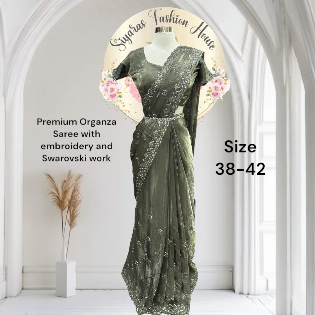 Premium organza saree. A subtle sparkle of Swarovski & elegant embroidery for a truly timeless look. 
 Comes with matching satin inner skirt , Blouse fits 38-42.