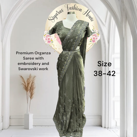 Premium organza saree. A subtle sparkle of Swarovski & elegant embroidery for a truly timeless look. 
 Comes with matching satin inner skirt , Blouse fits 38-42.