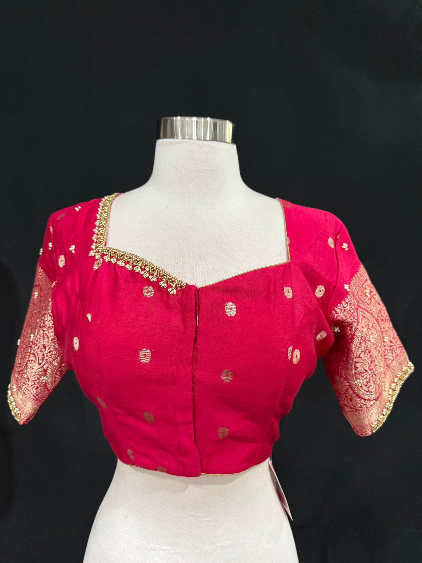 Stunning orange and pink combo Raw Mango silk saree paired with a contrasting pink blouse and Hand work on the blouse. Available in size 38 upto 42. Can be altered to your size.