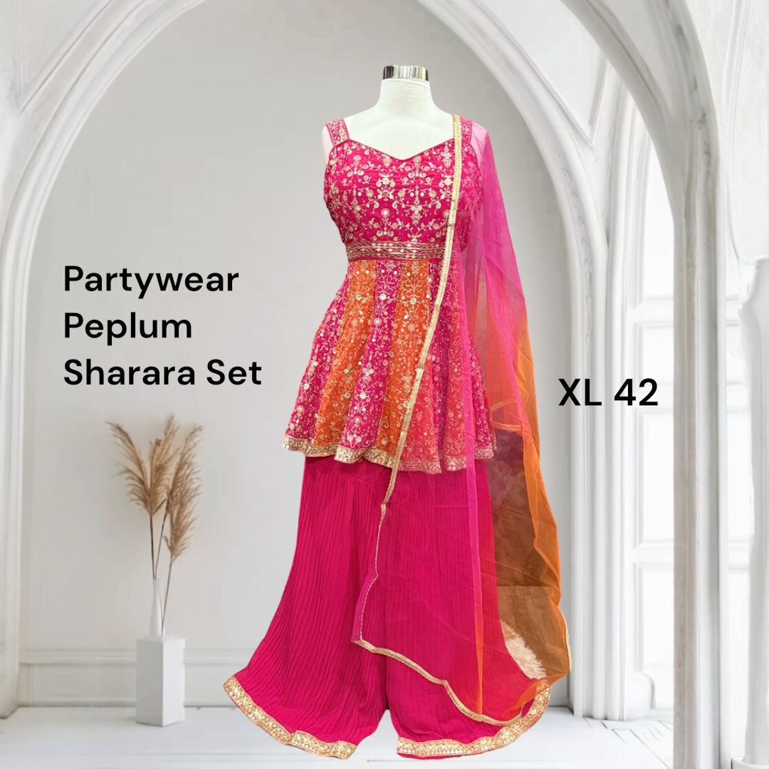 Stunning Partywear Peplum Sharara Set in vibrant shades of pink and orange comes with exquisite embroidery work. Perfect for weddings, sangeet, or festival. Size is  XL 42
